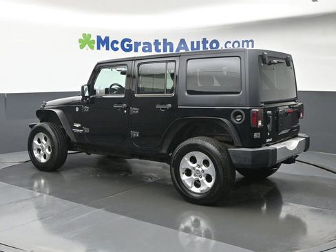 Used 2014 Jeep Wrangler Unlimited Sahara w/ Dual Top Group AWD/4WD image 24