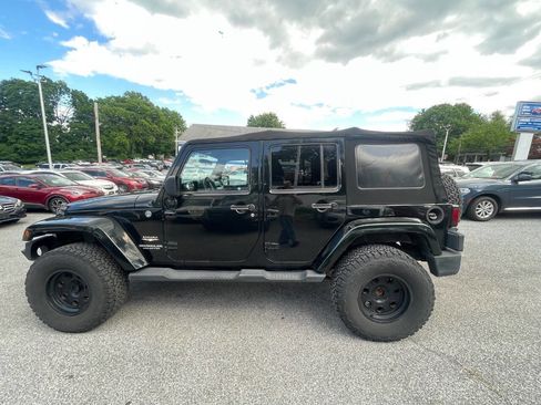 Used 2012 Jeep Wrangler Unlimited Sahara w/ Dual Top Group AWD/4WD image 9