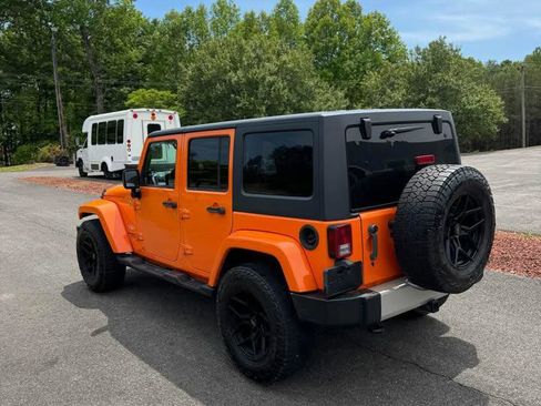 Used 2012 Jeep Wrangler Unlimited Sahara w/ Dual Top Group AWD/4WD image 2