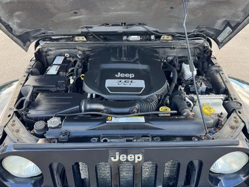 Used 2012 Jeep Wrangler Unlimited Sahara w/ Dual Top Group AWD/4WD image 23