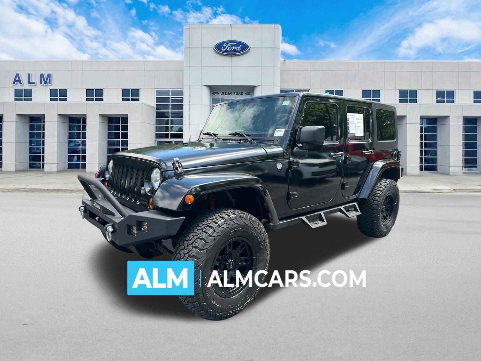Used 2013 Jeep Wrangler Unlimited Sahara AWD/4WD image 1