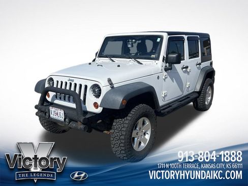 Used 2013 Jeep Wrangler Unlimited Sport AWD/4WD image 1