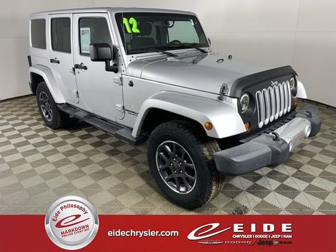 Used 2012 Jeep Wrangler Unlimited Sahara w/ Dual Top Group image 1