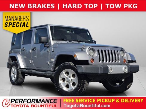 Used 2013 Jeep Wrangler Unlimited Sahara AWD/4WD image 1