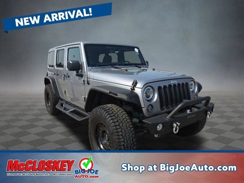 Used 2014 Jeep Wrangler Unlimited Sahara w/ Max Tow Package AWD/4WD image 1