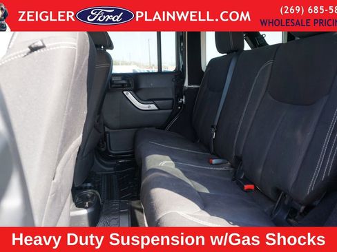 Used 2014 Jeep Wrangler Unlimited Sahara w/ Dual Top Group AWD/4WD image 11