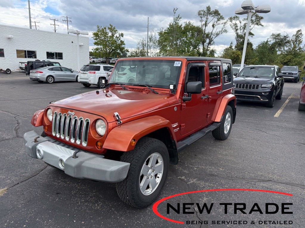 Used 2009 Jeep Wrangler Unlimited Sahara w/ Dual Top Group AWD/4WD image 1