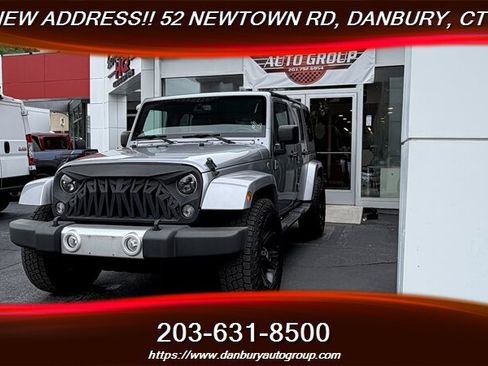 Used 2014 Jeep Wrangler Unlimited Sahara w/ Dual Top Group AWD/4WD image 1