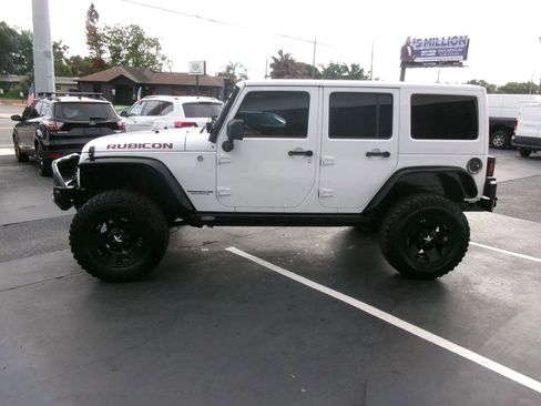 Used 2013 Jeep Wrangler Unlimited Rubicon w/ Dual Top Group AWD/4WD image 6