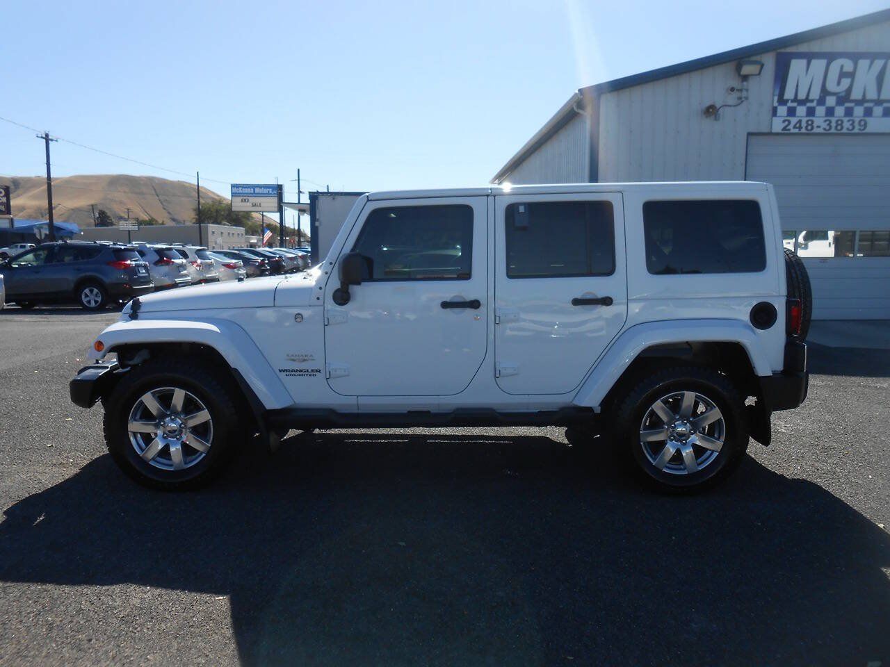 Used 2012 Jeep Wrangler Unlimited Sahara w/ Dual Top Group AWD/4WD image 6