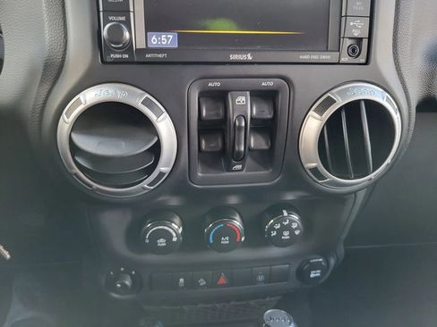 Used 2014 Jeep Wrangler Unlimited Sahara w/ Dual Top Group AWD/4WD image 12