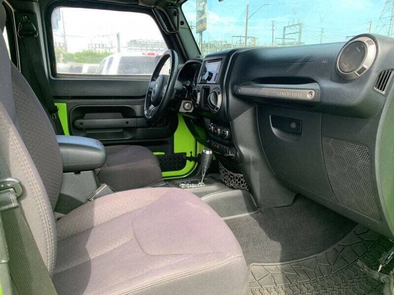 Used 2013 Jeep Wrangler Unlimited Sport w/ Mopar Black Appearance Group AWD/4WD image 9