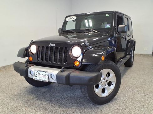 Used 2013 Jeep Wrangler Unlimited Sahara w/ Dual Top Group AWD/4WD image 1