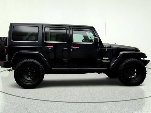 Used 2012 Jeep Wrangler Unlimited Sahara w/ Dual Top Group AWD/4WD image 4