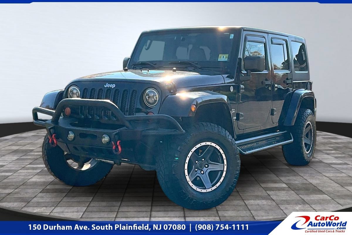Used 2012 Jeep Wrangler Unlimited Sahara w/ Dual Top Group AWD/4WD image 1