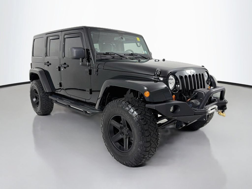 Used 2013 Jeep Wrangler Unlimited Sahara w/ Connectivity Group AWD/4WD image 1