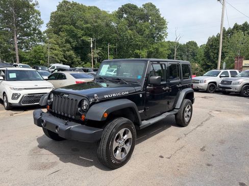 Used 2012 Jeep Wrangler Unlimited Rubicon w/ Dual Top Group AWD/4WD image 1