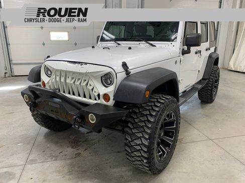 Used 2012 Jeep Wrangler Unlimited Sport image 1