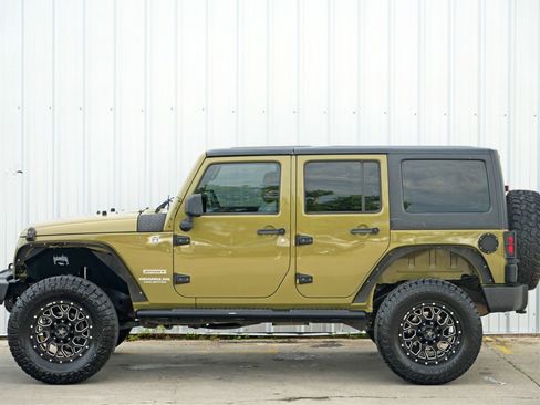 Used 2013 Jeep Wrangler Unlimited Sport w/ Mopar Black Appearance Group image 40