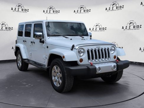 Used 2013 Jeep Wrangler Unlimited Sahara w/ Trailer Tow Group AWD/4WD image 1
