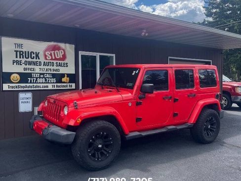 Used 2013 Jeep Wrangler Unlimited Sahara w/ Dual Top Group AWD/4WD image 1