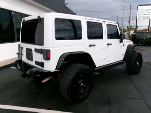 Used 2013 Jeep Wrangler Unlimited Rubicon w/ Dual Top Group AWD/4WD image 3