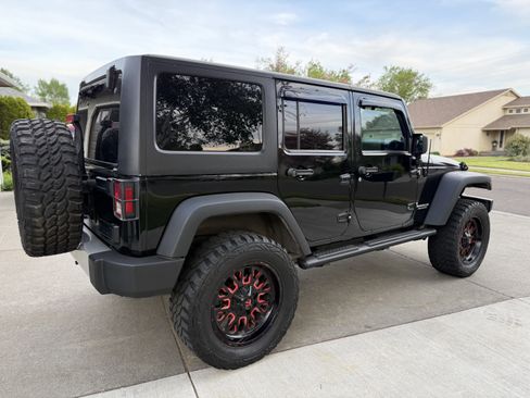 Used 2012 Jeep Wrangler Unlimited Sport w/ Black Appearance Group AWD/4WD image 2