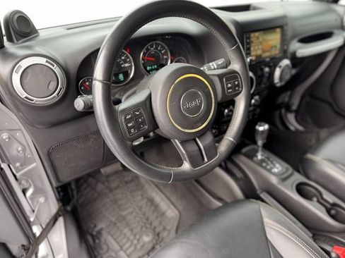 Used 2014 Jeep Wrangler Unlimited Sahara w/ Mopar Chrome Edition Group AWD/4WD image 16