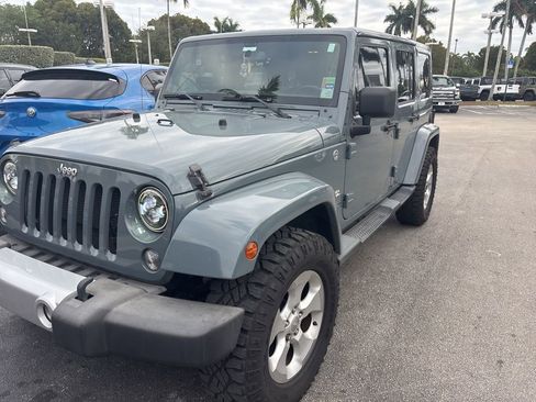 Used 2014 Jeep Wrangler Unlimited Sahara w/ Max Tow Package image 1