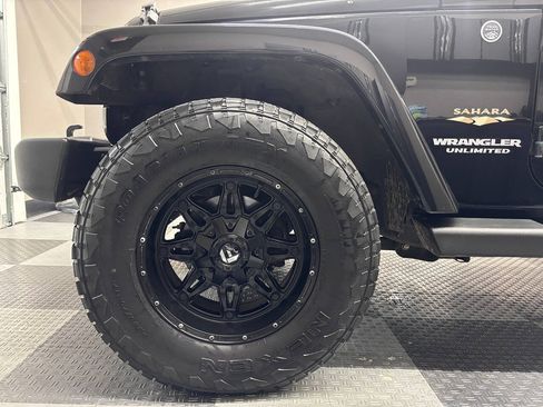 Used 2013 Jeep Wrangler Unlimited Sahara w/ Dual Top Group AWD/4WD image 11