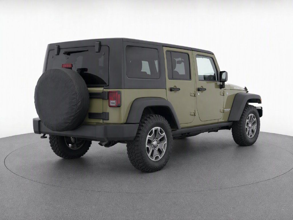 Used 2013 Jeep Wrangler Unlimited Rubicon w/ Dual Top Group AWD/4WD image 9