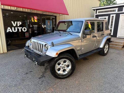 Used 2014 Jeep Wrangler Unlimited Sahara AWD/4WD image 1