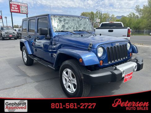 Used 2010 Jeep Wrangler Unlimited Sahara w/ Trailer Tow Group AWD/4WD image 1