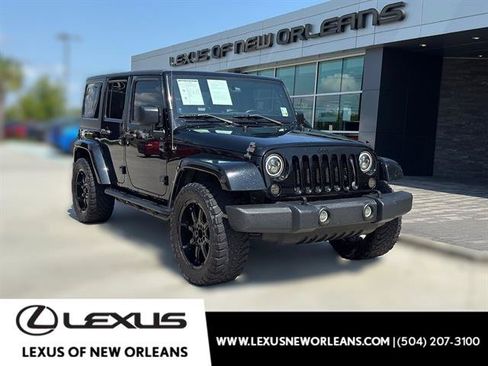Used 2012 Jeep Wrangler Unlimited Sahara w/ Mopar Chrome Edition Group AWD/4WD image 1