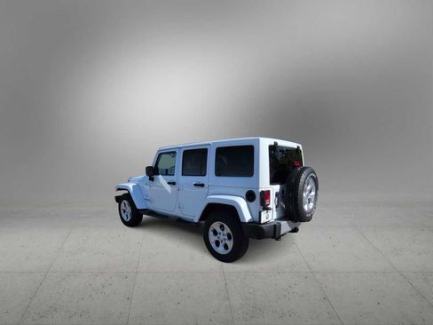Used 2014 Jeep Wrangler Unlimited Sahara w/ Dual Top Group AWD/4WD image 6