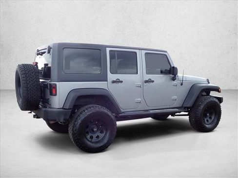 Used 2013 Jeep Wrangler Unlimited Sport w/ Mopar Black Appearance Group AWD/4WD image 4