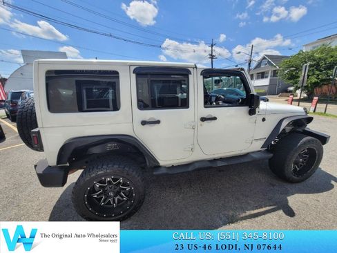 Used 2014 Jeep Wrangler Unlimited Sahara w/ Dual Top Group AWD/4WD image 12