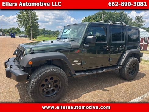 Used 2011 Jeep Wrangler Unlimited Sahara w/ Dual Top Group AWD/4WD image 1