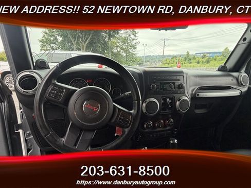 Used 2014 Jeep Wrangler Unlimited Sahara w/ Dual Top Group AWD/4WD image 13