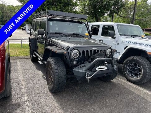 Used 2014 Jeep Wrangler Unlimited Rubicon w/ Dual Top Group AWD/4WD image 1
