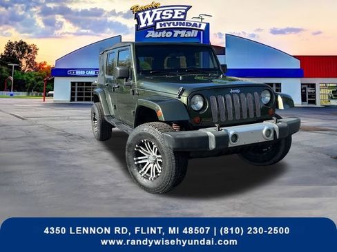 Used 2009 Jeep Wrangler Unlimited Sahara w/ Dual Top Group AWD/4WD image 1