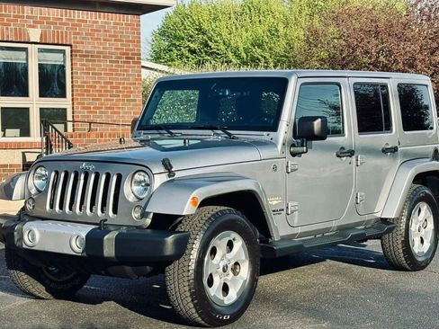 Used 2014 Jeep Wrangler Unlimited Sahara w/ Dual Top Group image 1