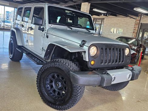 Used 2012 Jeep Wrangler Unlimited Sahara w/ Dual Top Group AWD/4WD image 1