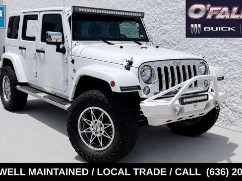Used 2014 Jeep Wrangler Unlimited Sahara w/ Mopar Chrome Edition Group AWD/4WD image 1