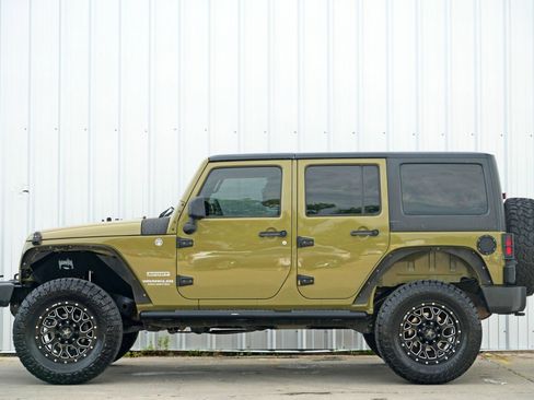 Used 2013 Jeep Wrangler Unlimited Sport w/ Mopar Black Appearance Group image 8