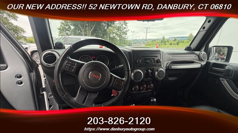 Used 2014 Jeep Wrangler Unlimited Sahara w/ Dual Top Group AWD/4WD image 13