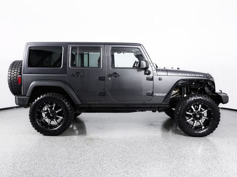 Used 2014 Jeep Wrangler Unlimited Rubicon w/ Dual Top Group AWD/4WD image 10