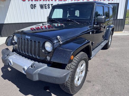 Used 2014 Jeep Wrangler Unlimited Sahara w/ Dual Top Group AWD/4WD image 2
