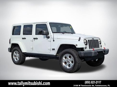 Used 2014 Jeep Wrangler Unlimited Sahara AWD/4WD image 1