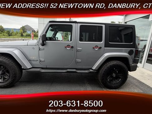 Used 2014 Jeep Wrangler Unlimited Sahara w/ Dual Top Group AWD/4WD image 2